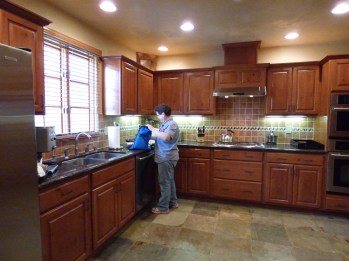 A complete kitchen with all the gadgets.
