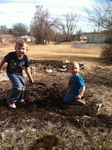 My grandsons helping me prep the garden.